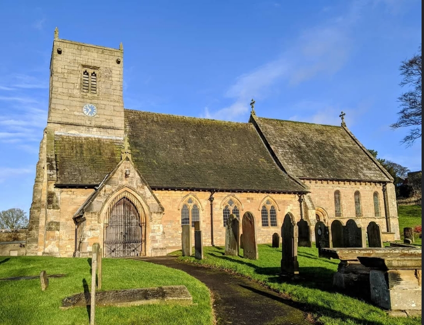 St Oswald's in soft warm light, viewed from the south