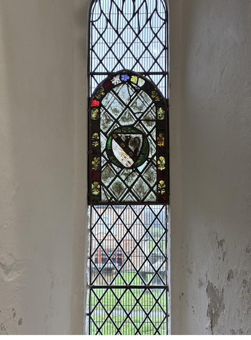 The restored window seen from inside St Oswald's Church, the medieval panel reinstated within its lancet and fully visible in its original setting